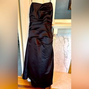 Black tie formal gown; straps or strapless.